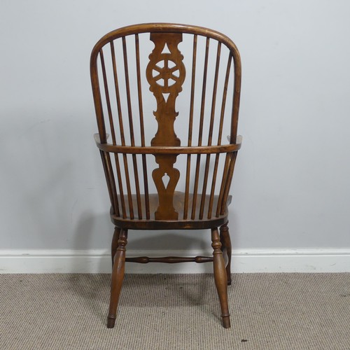 637 - An antique ash and elm windsor Armchair, hoop stick and splat back above squashed pad arms, above sh... 