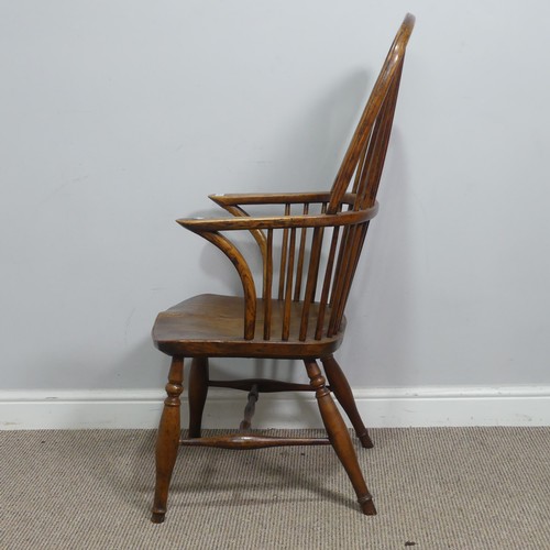 637 - An antique ash and elm windsor Armchair, hoop stick and splat back above squashed pad arms, above sh... 