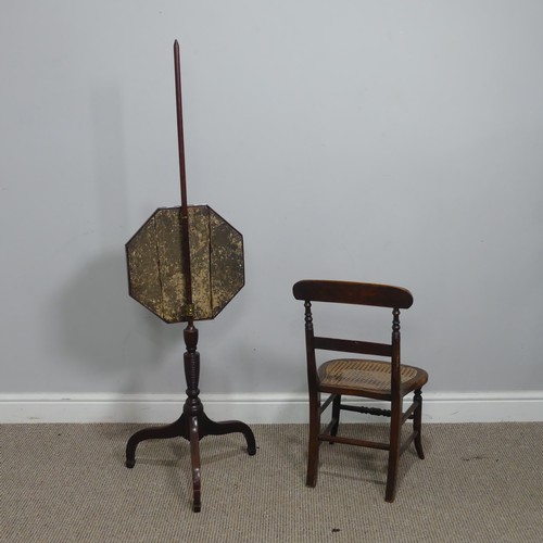 624 - A 19th century mahogany Pole Screen, with octagonal embroidered panel raised on tripod base, H 132 c... 