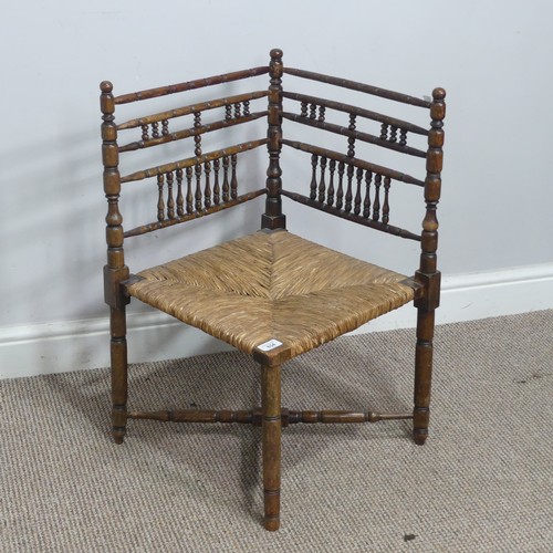 634 - A 19th century sussex-style bobbin turned corner Chair, with rush seat, W 41 cm x H 68 cm x D 42 cm.... 