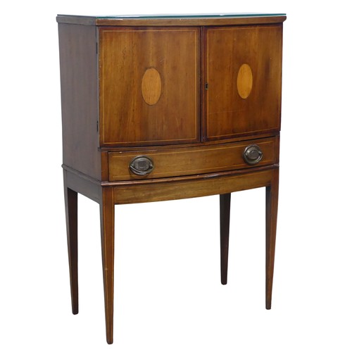 631 - An Edwardian mahogany bow-fronted and inlaid side Cupboard, of small proportions, with two small cup... 