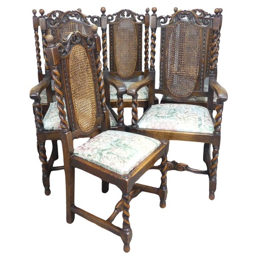 612 - A set of six Carolean style oak dining Chairs, carved scroll pediments flanked by turned finials, ab... 