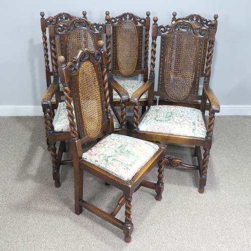 612 - A set of six Carolean style oak dining Chairs, carved scroll pediments flanked by turned finials, ab... 