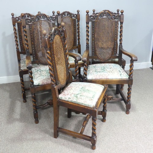 612 - A set of six Carolean style oak dining Chairs, carved scroll pediments flanked by turned finials, ab... 