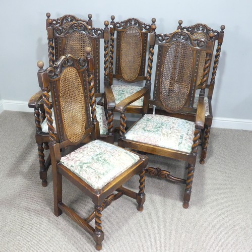 612 - A set of six Carolean style oak dining Chairs, carved scroll pediments flanked by turned finials, ab... 