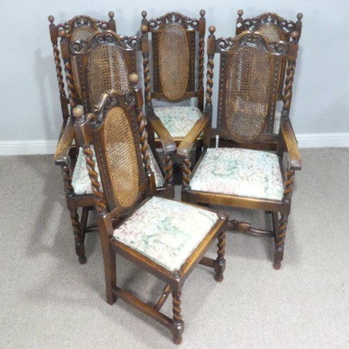 612 - A set of six Carolean style oak dining Chairs, carved scroll pediments flanked by turned finials, ab... 