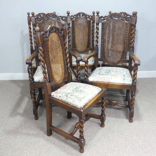 612 - A set of six Carolean style oak dining Chairs, carved scroll pediments flanked by turned finials, ab... 