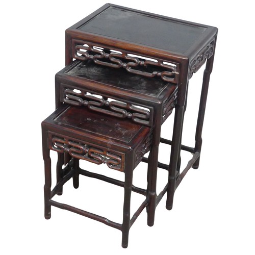 130 - A Chinese nest of three hardwood Tables, probably huanghuali, circa 1900, rectangular tops above mou... 