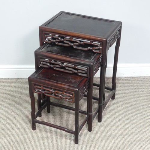 130 - A Chinese nest of three hardwood Tables, probably huanghuali, circa 1900, rectangular tops above mou... 