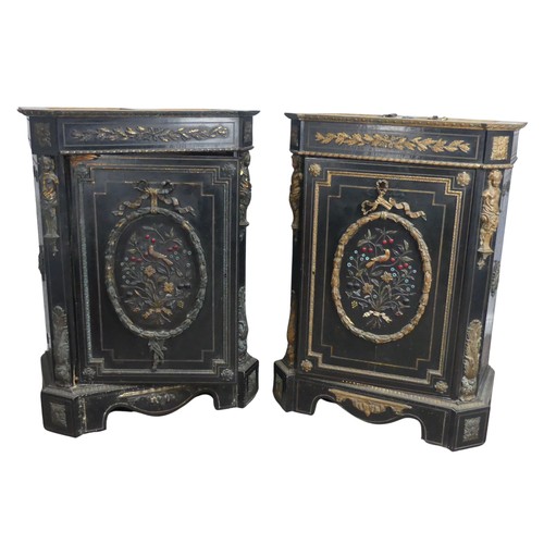 584 - A pair of Moroccan style black lacquered and gilt Cabinets, marbles tops above central gilt metal fo... 