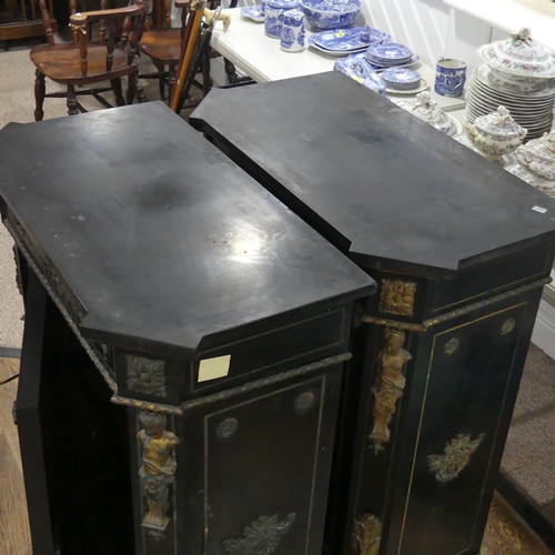 584 - A pair of Moroccan style black lacquered and gilt Cabinets, marbles tops above central gilt metal fo... 