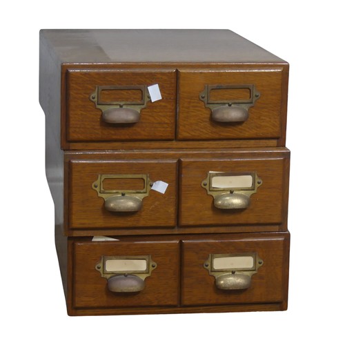 577 - Three early 20th century oak two drawer Filing Cabinets, with brass cup handles and index holders, e... 