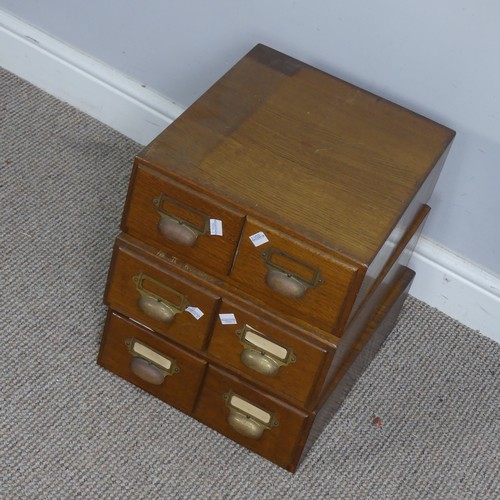 577 - Three early 20th century oak two drawer Filing Cabinets, with brass cup handles and index holders, e... 