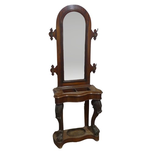 562 - A Victorian mahogany serpentine front Hall Stand, of narrow proportions, arched mirror flanked by tw... 