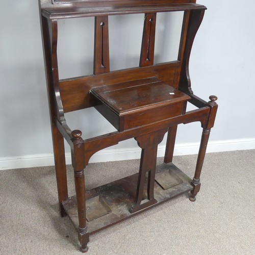 597 - A Victorian mahogany Hall Stand, with pierced Gothic style apertures above oval bevelled mirror and ... 