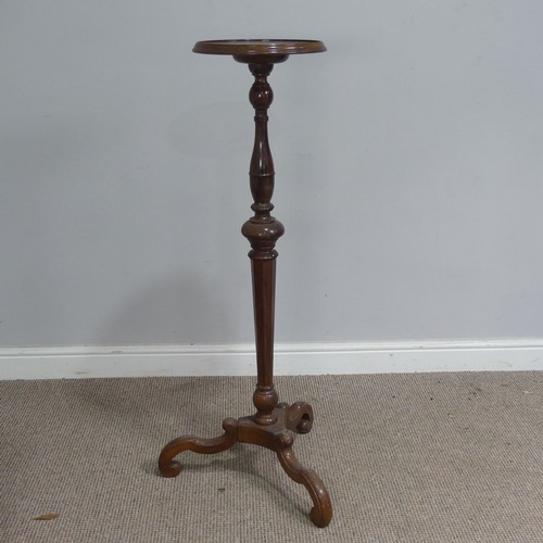 513 - A Victorian style mahogany plant Stand, moulded circular top on turned and canted column, raise... 