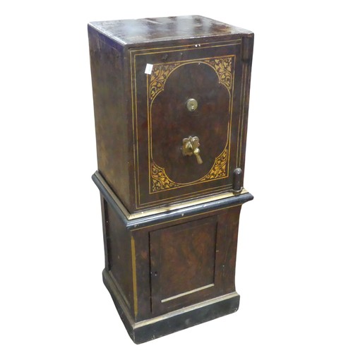 600 - A faux wood metal painted floor standing Safe, by 'Hobbs & co, London', floor screws and key pre... 