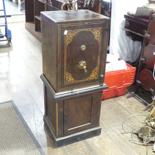 600 - A faux wood metal painted floor standing Safe, by 'Hobbs & co, London', floor screws and key pre... 