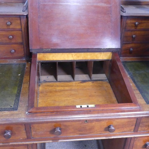 571 - A Victorian oak 'Dickens' pedestal Desk, central top shelf with spindle gallery flanked by wellingto... 