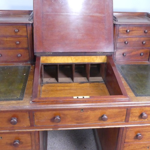 571 - A Victorian oak 'Dickens' pedestal Desk, central top shelf with spindle gallery flanked by wellingto... 