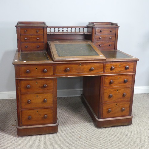 571 - A Victorian oak 'Dickens' pedestal Desk, central top shelf with spindle gallery flanked by wellingto... 