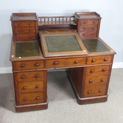 571 - A Victorian oak 'Dickens' pedestal Desk, central top shelf with spindle gallery flanked by wellingto... 