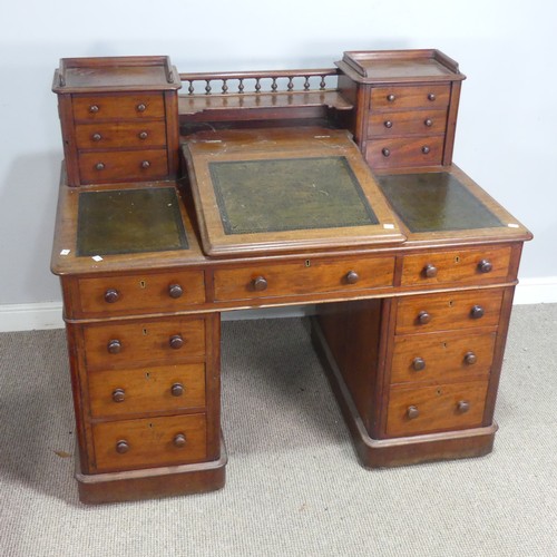 571 - A Victorian oak 'Dickens' pedestal Desk, central top shelf with spindle gallery flanked by wellingto... 