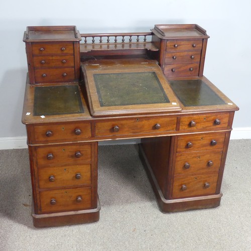 571 - A Victorian oak 'Dickens' pedestal Desk, central top shelf with spindle gallery flanked by wellingto... 