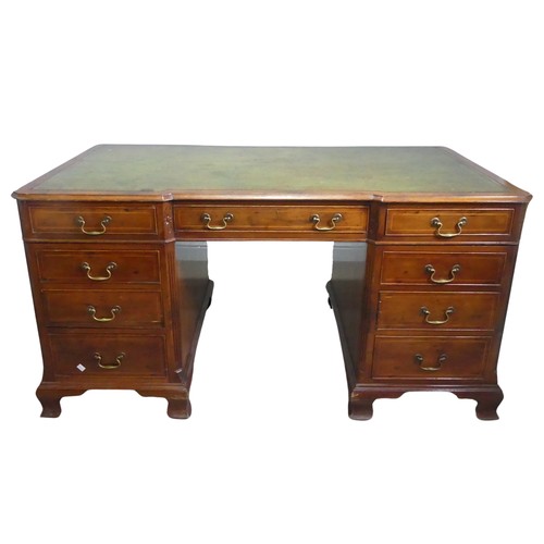 712 - An early 20th century mahogany Partner's Desk, moulded top with gilt tooled leather writing skiver, ... 