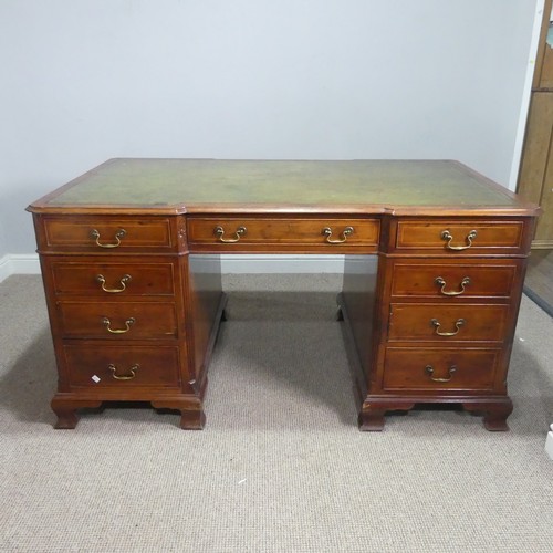 712 - An early 20th century mahogany Partner's Desk, moulded top with gilt tooled leather writing skiver, ... 