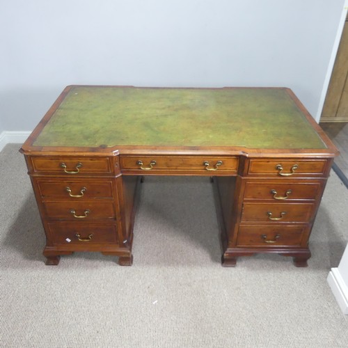 712 - An early 20th century mahogany Partner's Desk, moulded top with gilt tooled leather writing skiver, ... 