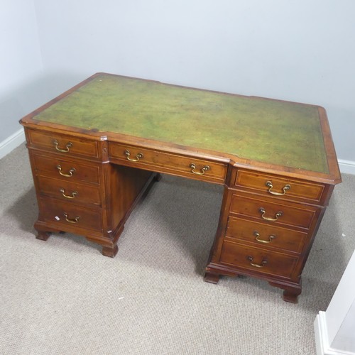 712 - An early 20th century mahogany Partner's Desk, moulded top with gilt tooled leather writing skiver, ... 