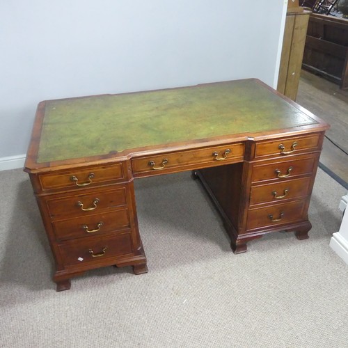 712 - An early 20th century mahogany Partner's Desk, moulded top with gilt tooled leather writing skiver, ... 