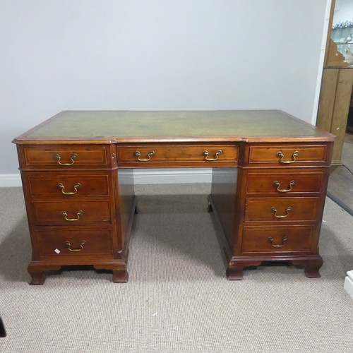 712 - An early 20th century mahogany Partner's Desk, moulded top with gilt tooled leather writing skiver, ... 