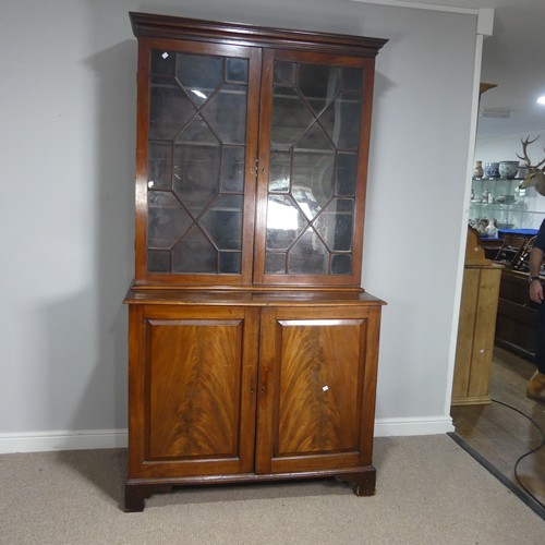 648 - A 19th century mahogany astragal glazed Bookcase, moulded cornice above two glazed cupboard doors co... 