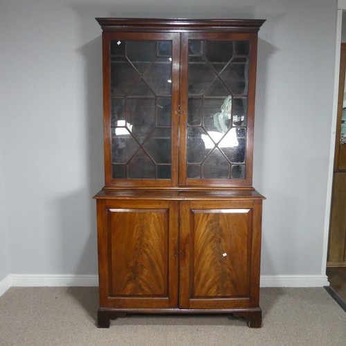 648 - A 19th century mahogany astragal glazed Bookcase, moulded cornice above two glazed cupboard doors co... 