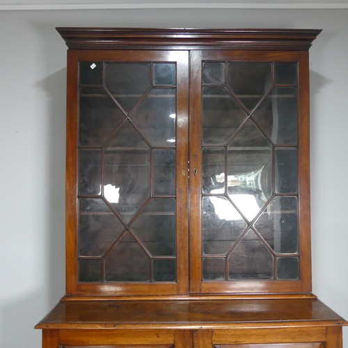 648 - A 19th century mahogany astragal glazed Bookcase, moulded cornice above two glazed cupboard doors co... 