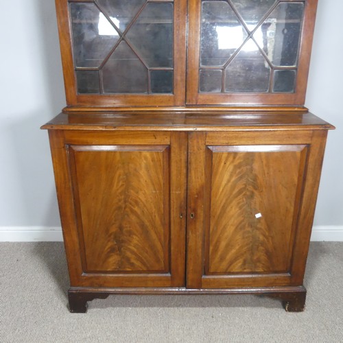 648 - A 19th century mahogany astragal glazed Bookcase, moulded cornice above two glazed cupboard doors co... 