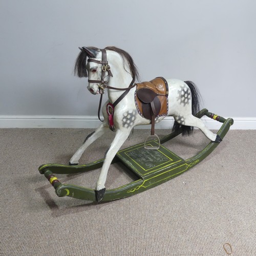 666 - A good early 20th century carved and painted rocking Horse, with saddle, hair, and glass eyes, quote... 