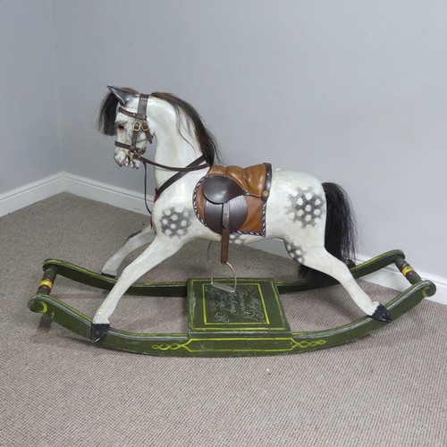 666 - A good early 20th century carved and painted rocking Horse, with saddle, hair, and glass eyes, quote... 