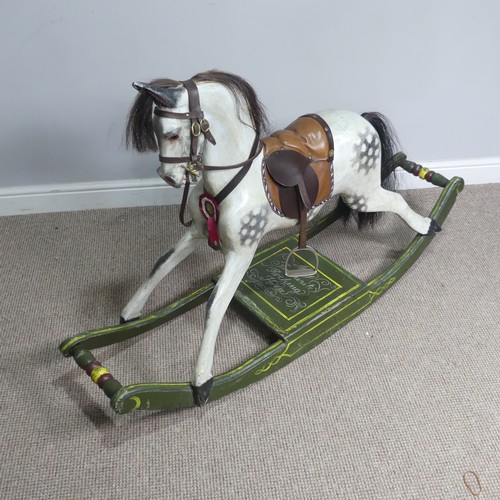 666 - A good early 20th century carved and painted rocking Horse, with saddle, hair, and glass eyes, quote... 