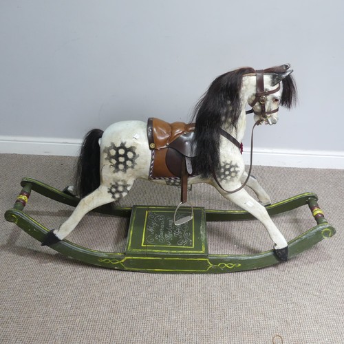 666 - A good early 20th century carved and painted rocking Horse, with saddle, hair, and glass eyes, quote... 