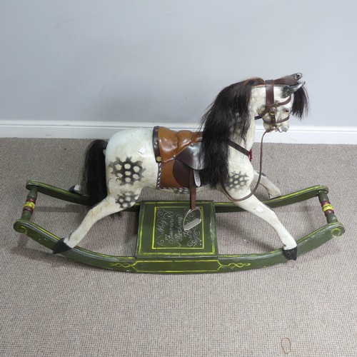 666 - A good early 20th century carved and painted rocking Horse, with saddle, hair, and glass eyes, quote... 