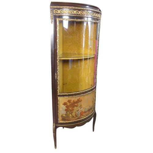 656 - A French Louis XVI style bow-fronted corner display Cabinet, with gilt metal mounts depicting floral... 