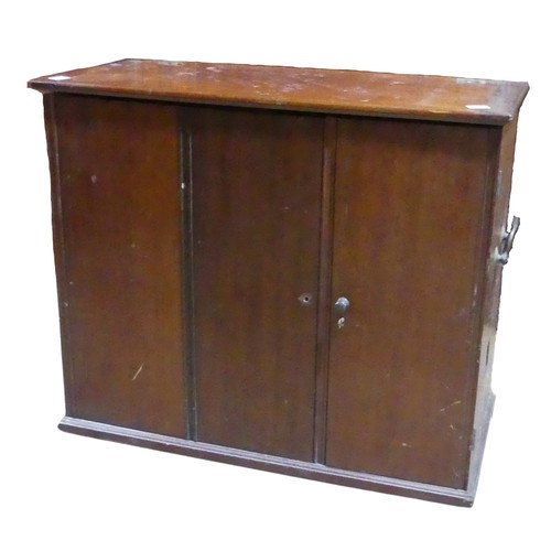 679 - An antique mahogany storage Cabinet, hinged top over three doors concealing varying compartments, br... 