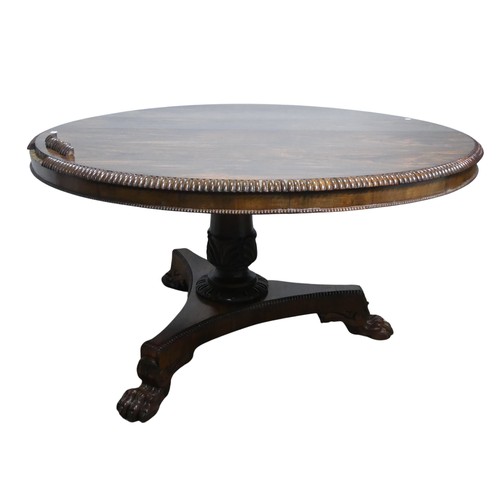 652 - A Victorian rosewood circular breakfast Table, with beaded edges raised on carved column and tripod ... 