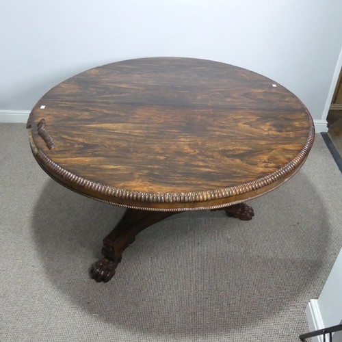 652 - A Victorian rosewood circular breakfast Table, with beaded edges raised on carved column and tripod ... 