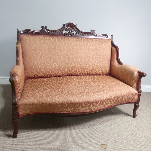 662 - An Edwardian mahogany framed three-seat parlour Sofa, with carved shell and scroll pediment above up... 