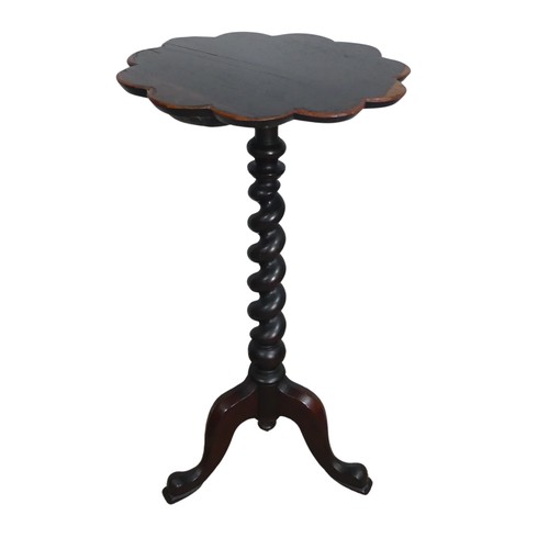 604 - An antique mahogany wine Table, petal shaped top raised on barley twist column, upon tripod cabriole... 