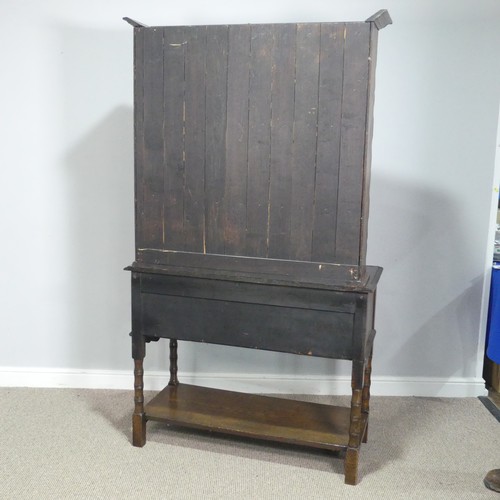 610 - A Carolean style oak Dresser, moulded cornice over pierced frieze and two shelves, above two moulded... 